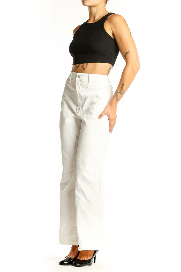 Front view of Madewell white high-waisted wide-leg jeans on model