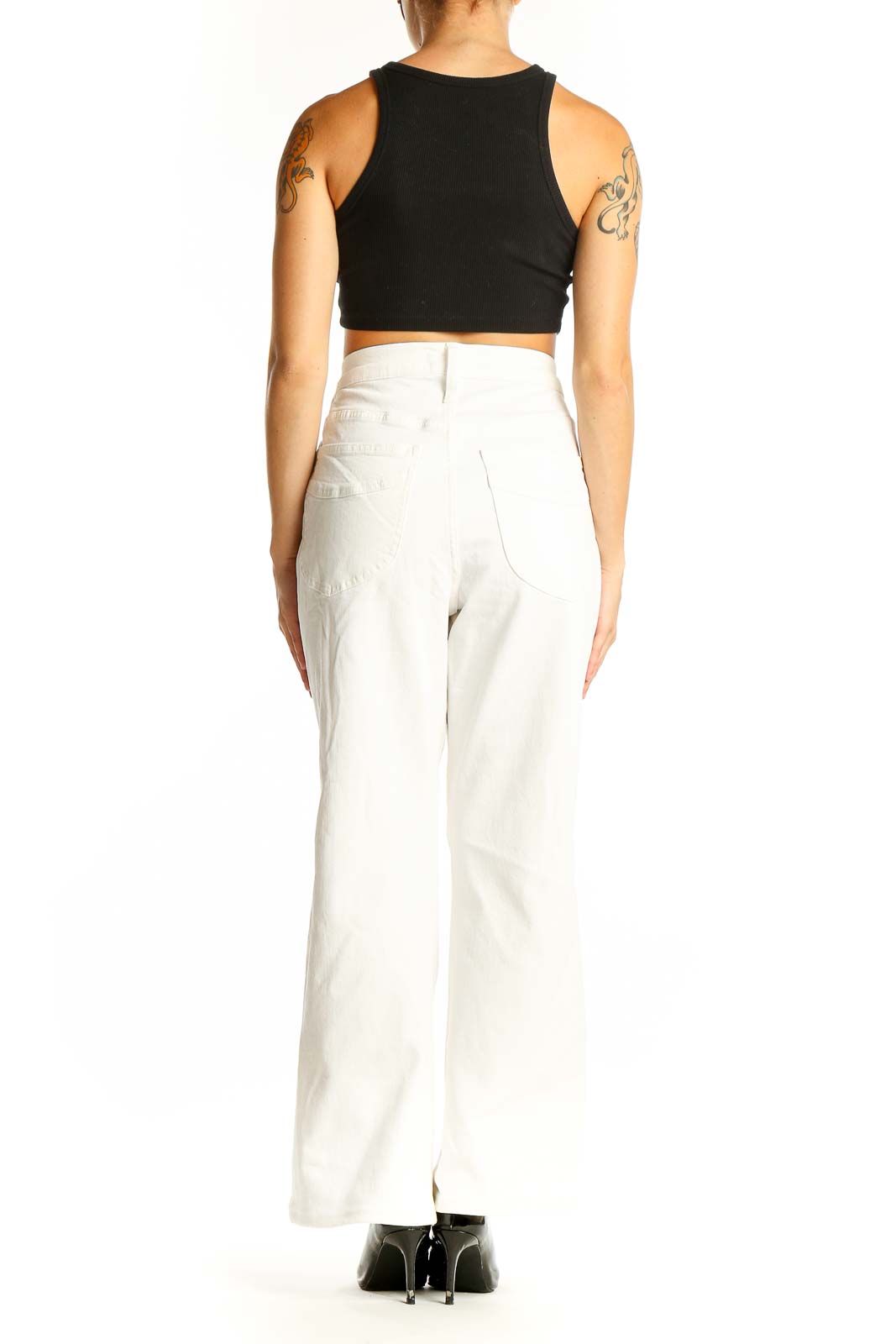 Side view of Madewell white high-waisted wide-leg jeans with black crop top