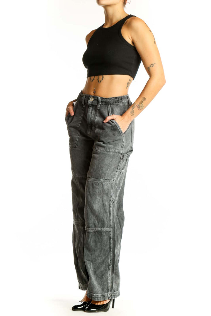 Front view of BDG gray washed cotton cargo jeans with wide legs and utility pockets