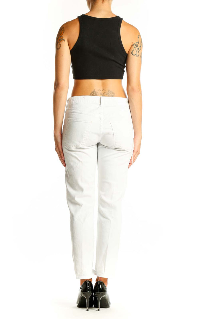 Side view of white distressed slim fit jeans by Citizens of Humanity