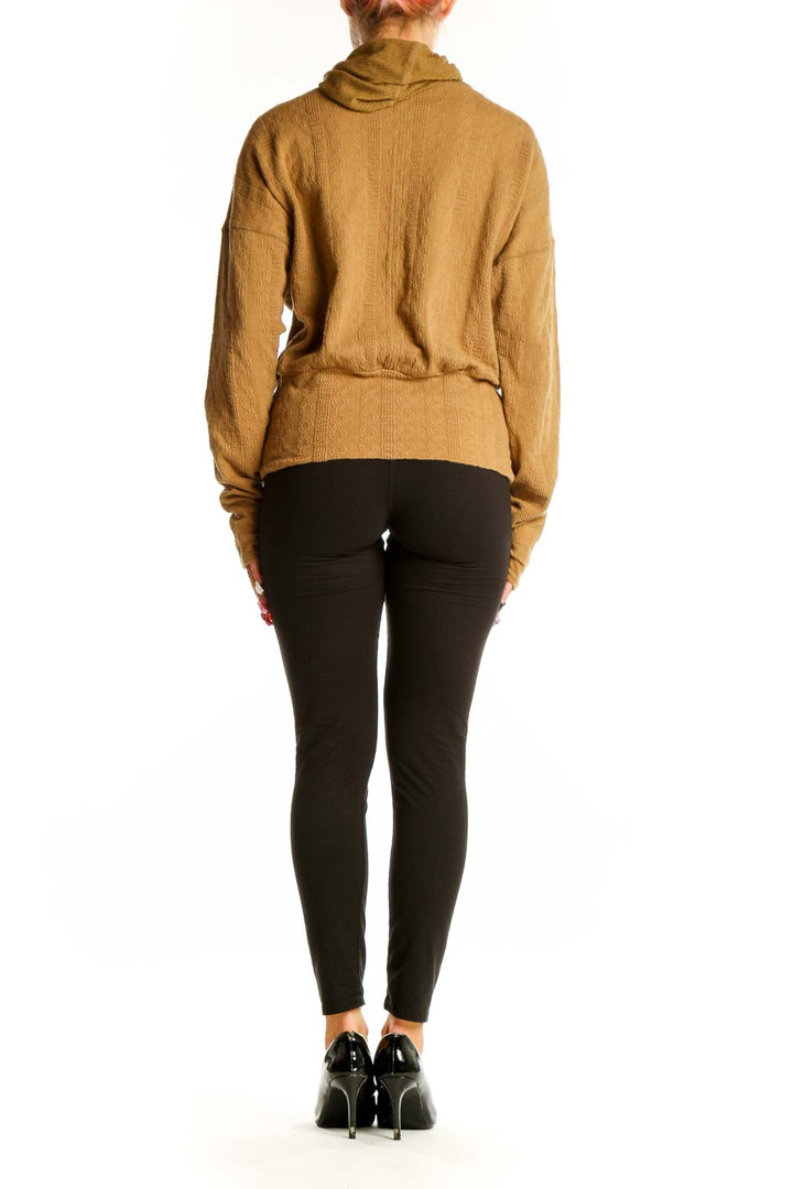Back view of camel-colored ribbed drawstring hoodie from FP Movement