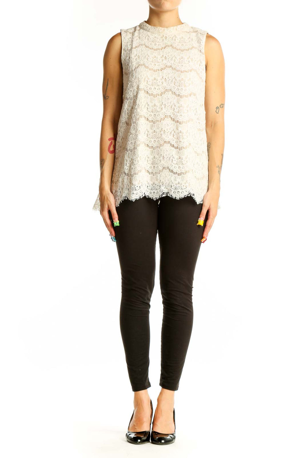 Front view of white lace sleeveless blouse with floral pattern