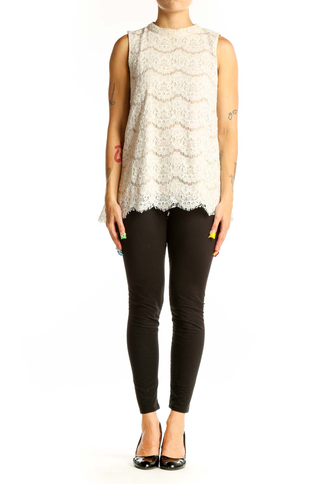 Front view of white lace sleeveless blouse with floral pattern
