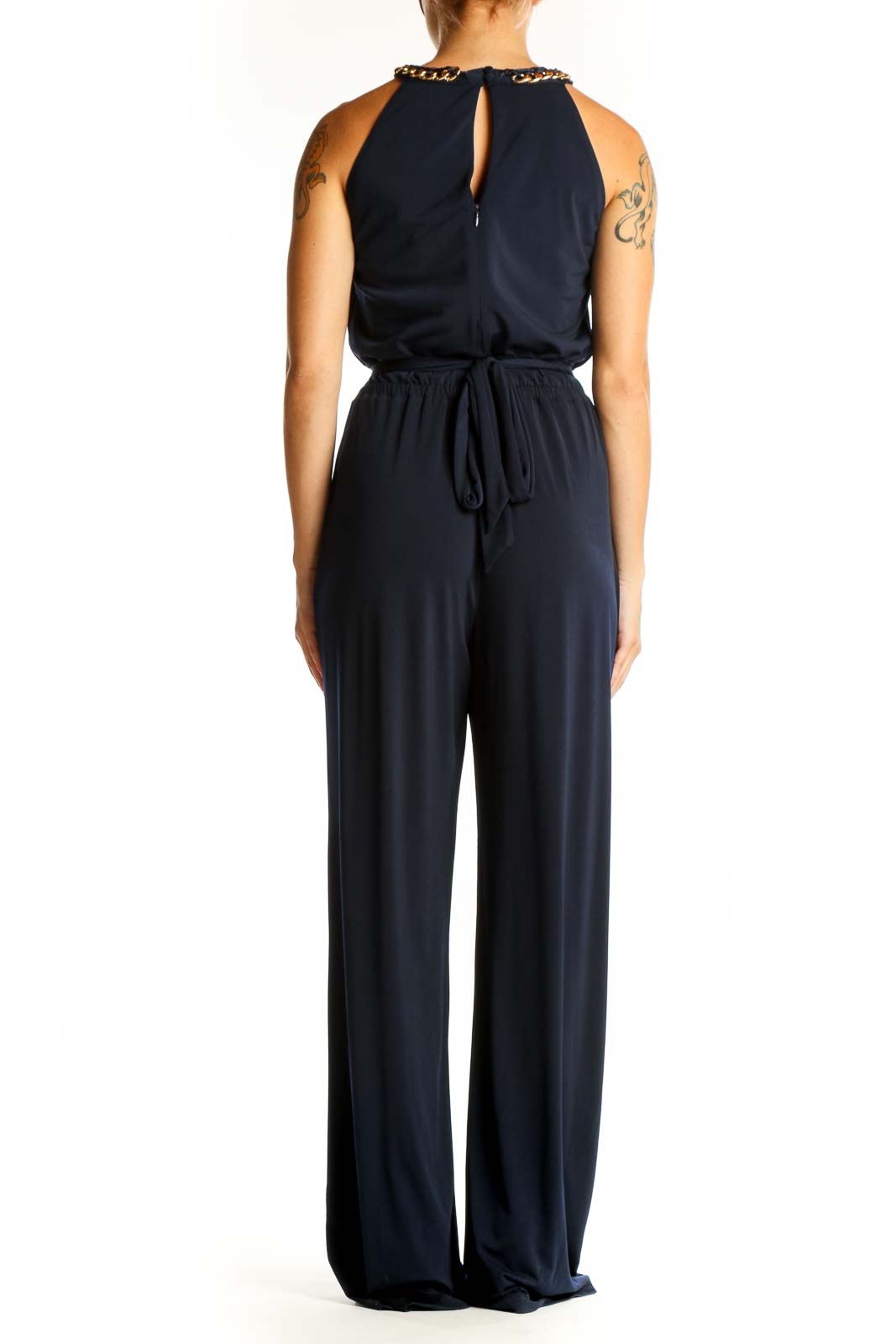 Side view of Vince Camuto navy wide-leg jumpsuit showing flowy silhouette