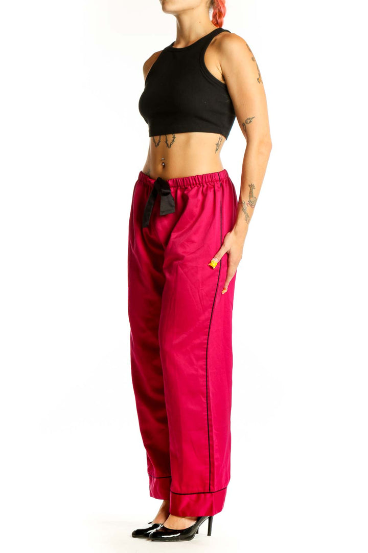 Front view of red Oscar de la Renta PINK LABEL lounge pants with black drawstring