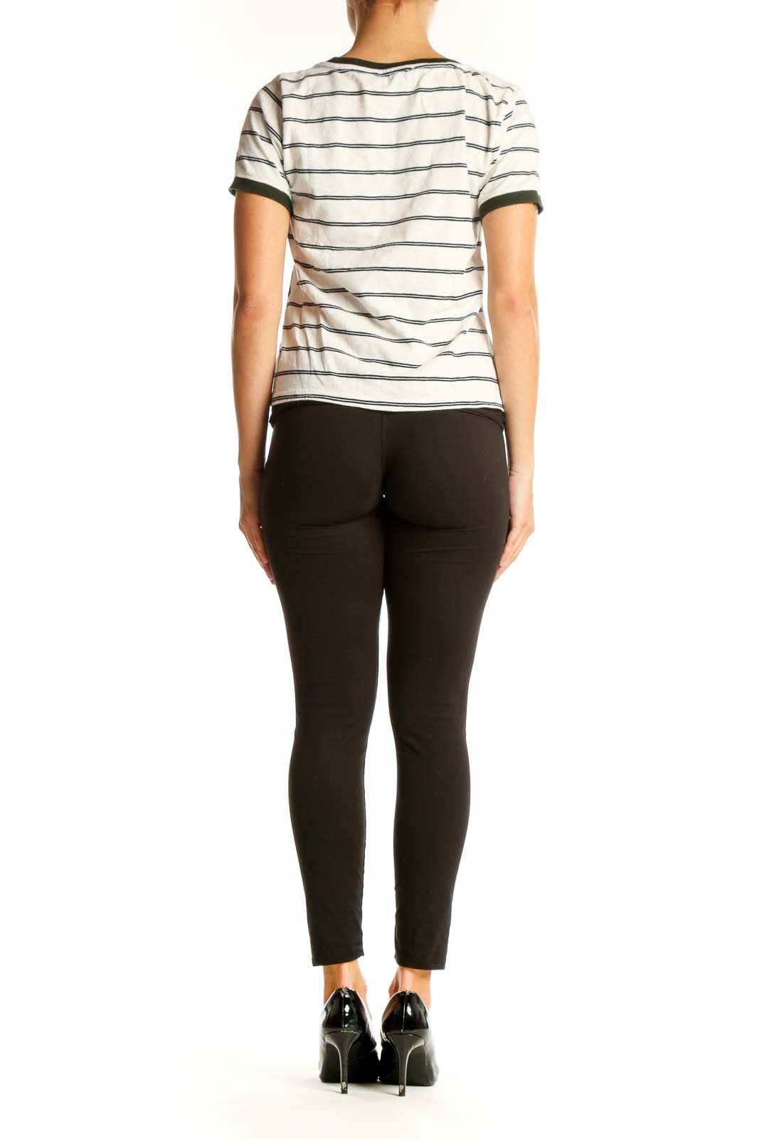 Side view of J.Crew white cotton top with green chevron stripes and black pants