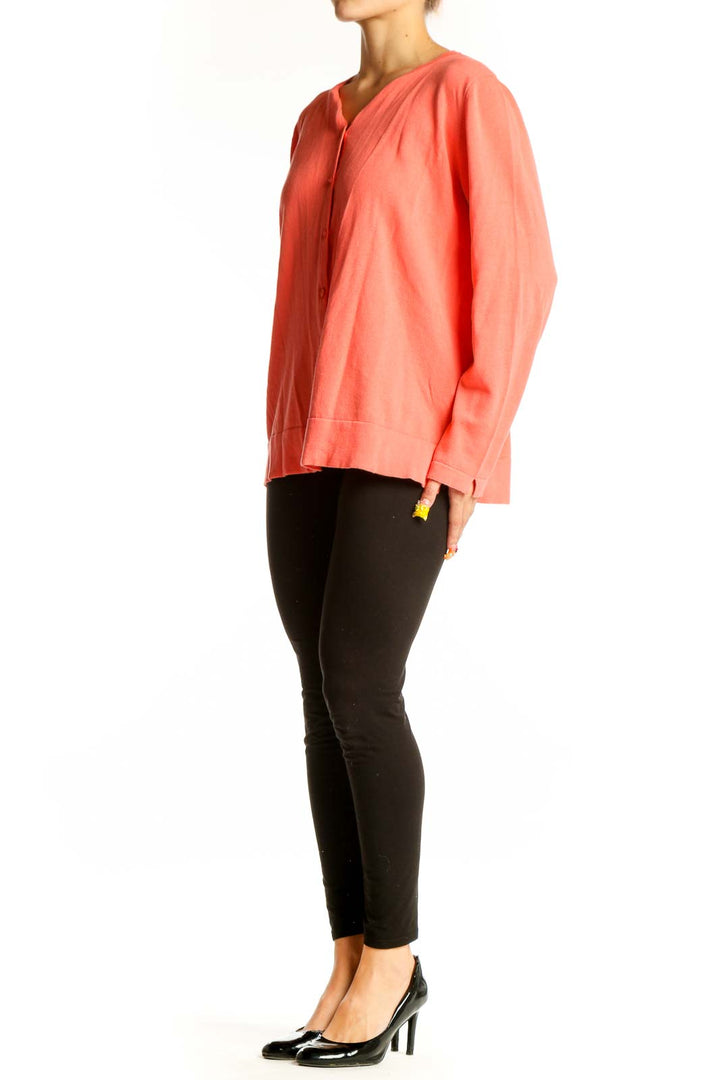 Front view of coral button-up cotton cardigan from El Corte Ingles