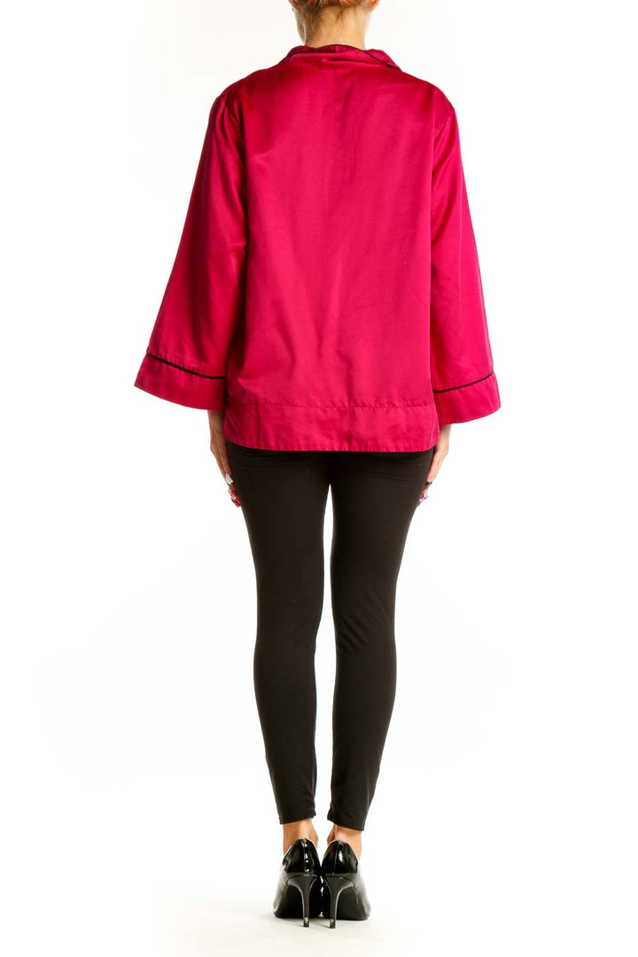 Side view of hot pink Oscar de la Renta PINK LABEL button-down blouse on model