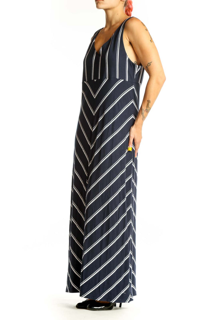 Front view of Athleta navy striped maxi dress with V-neck and chevron pattern