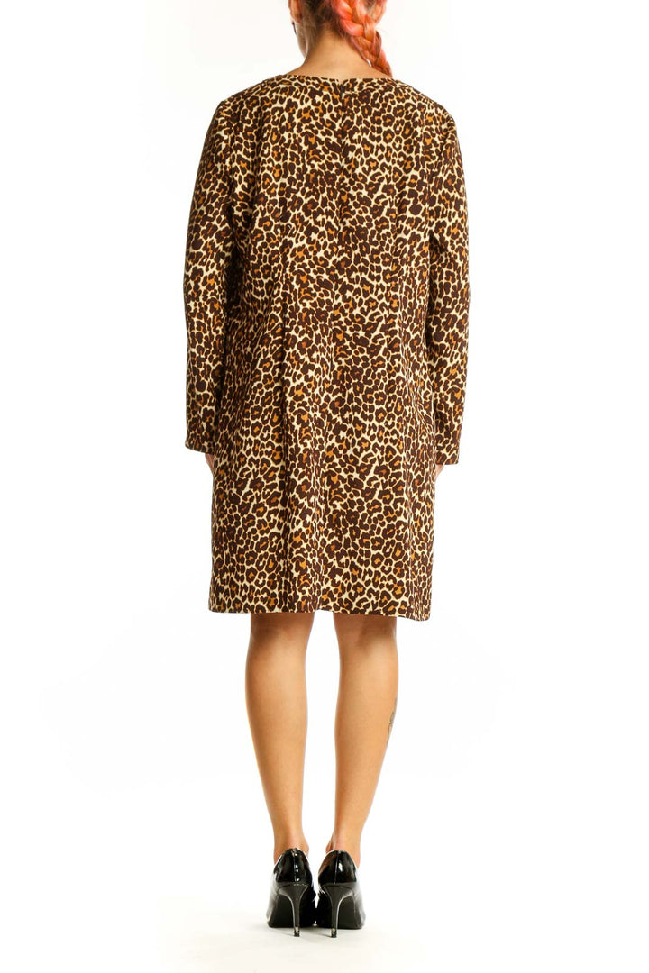 Side view of J.Crew leopard print shift dress showing knee-length cut