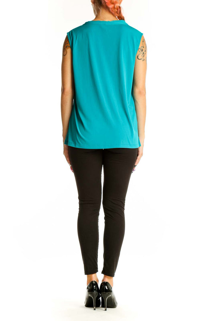 Side view of teal Calvin Klein sleeveless top on model