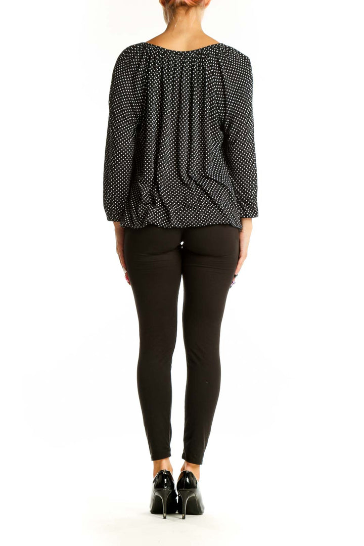 Side view of MICHAEL Michael Kors Black Polka Dot Peasant Blouse on model