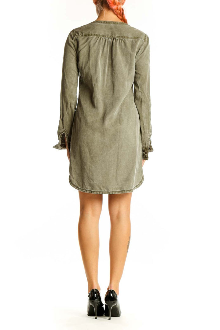 Side view of olive green Express tunic dress showing long sleeves and curved hemline