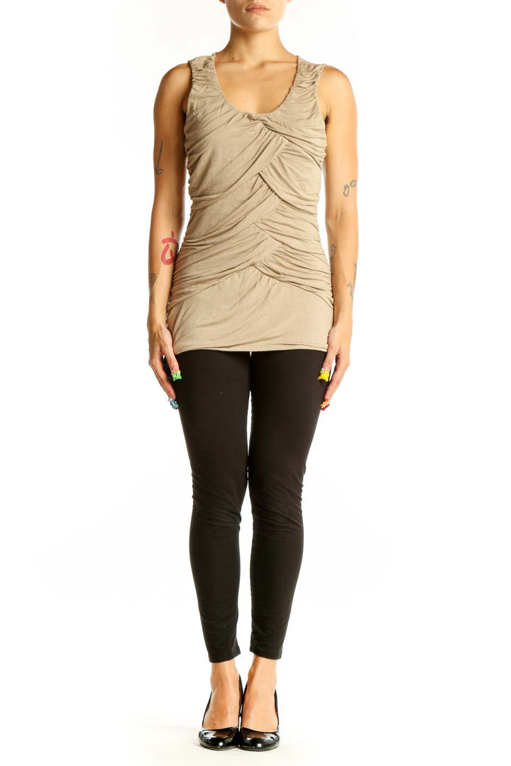 Front view of beige ruched sleeveless top from Maurices