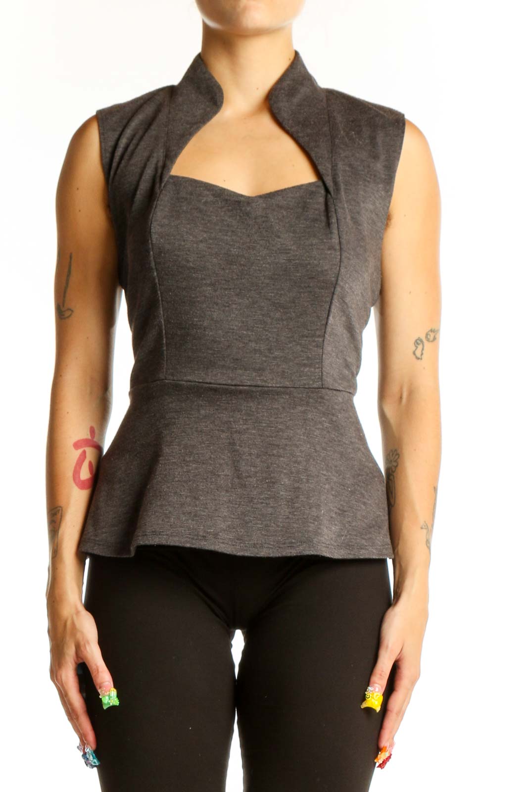 Front view of Eva Franco gray sleeveless peplum top with high collar