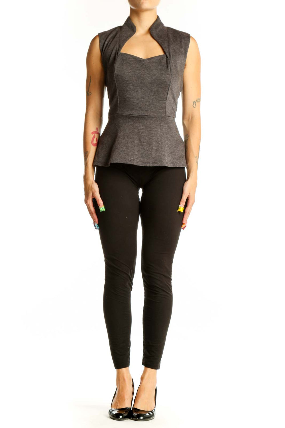 Front view of Eva Franco gray sleeveless peplum top with high collar