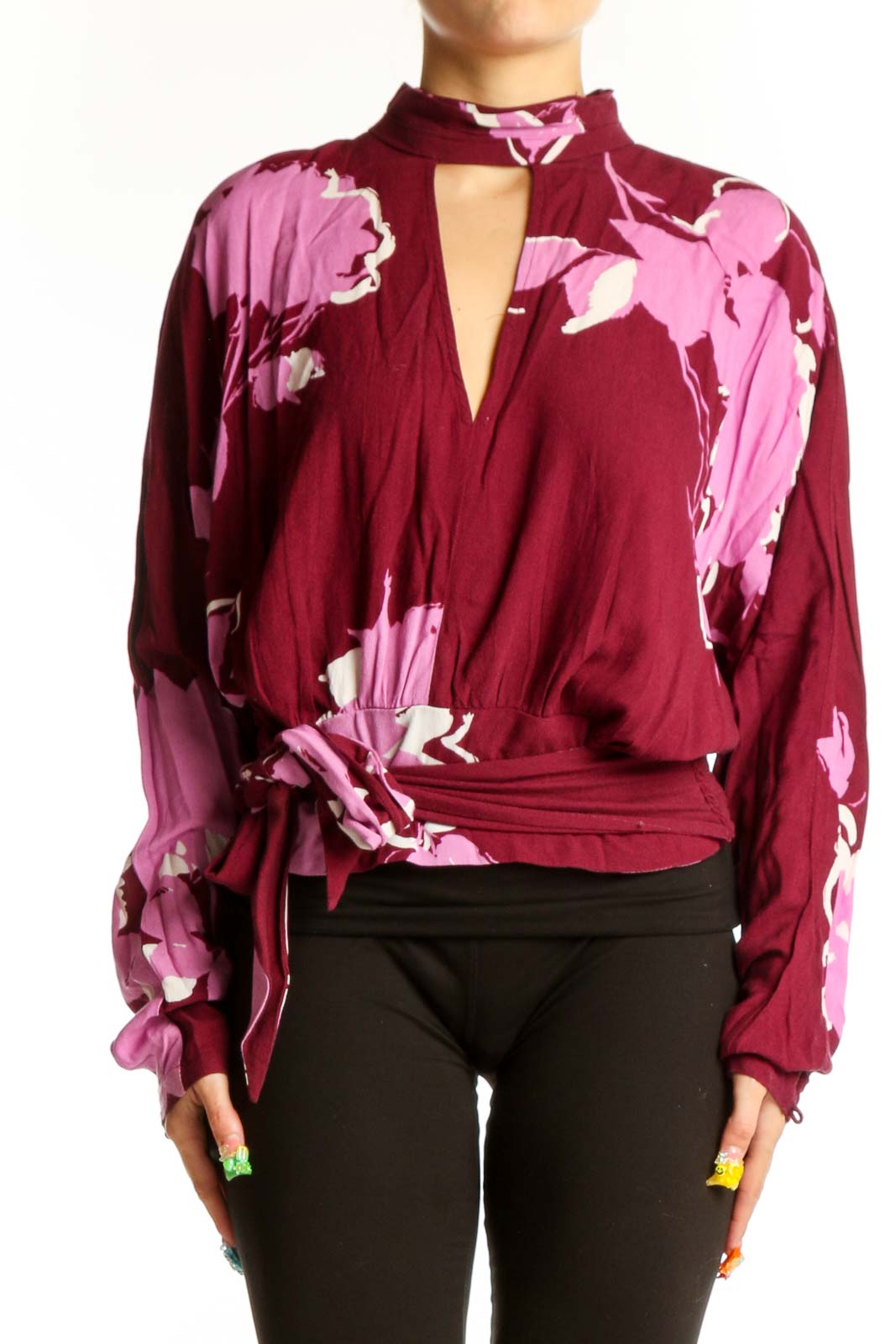 Front view of burgundy floral print wrap top with V-neckline and choker collar