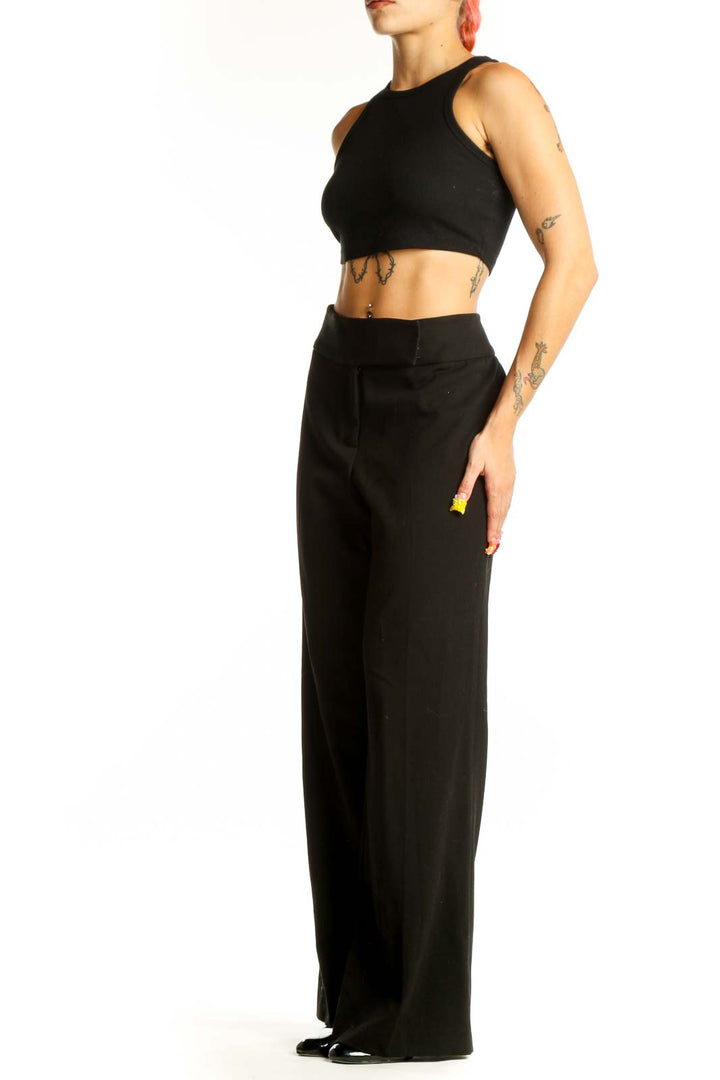 Front view of Vesti black wide-leg dress pants on model