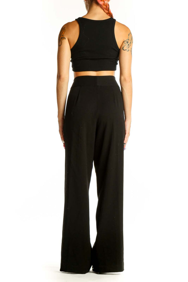 Side view of Vesti black wide-leg dress pants with crop top