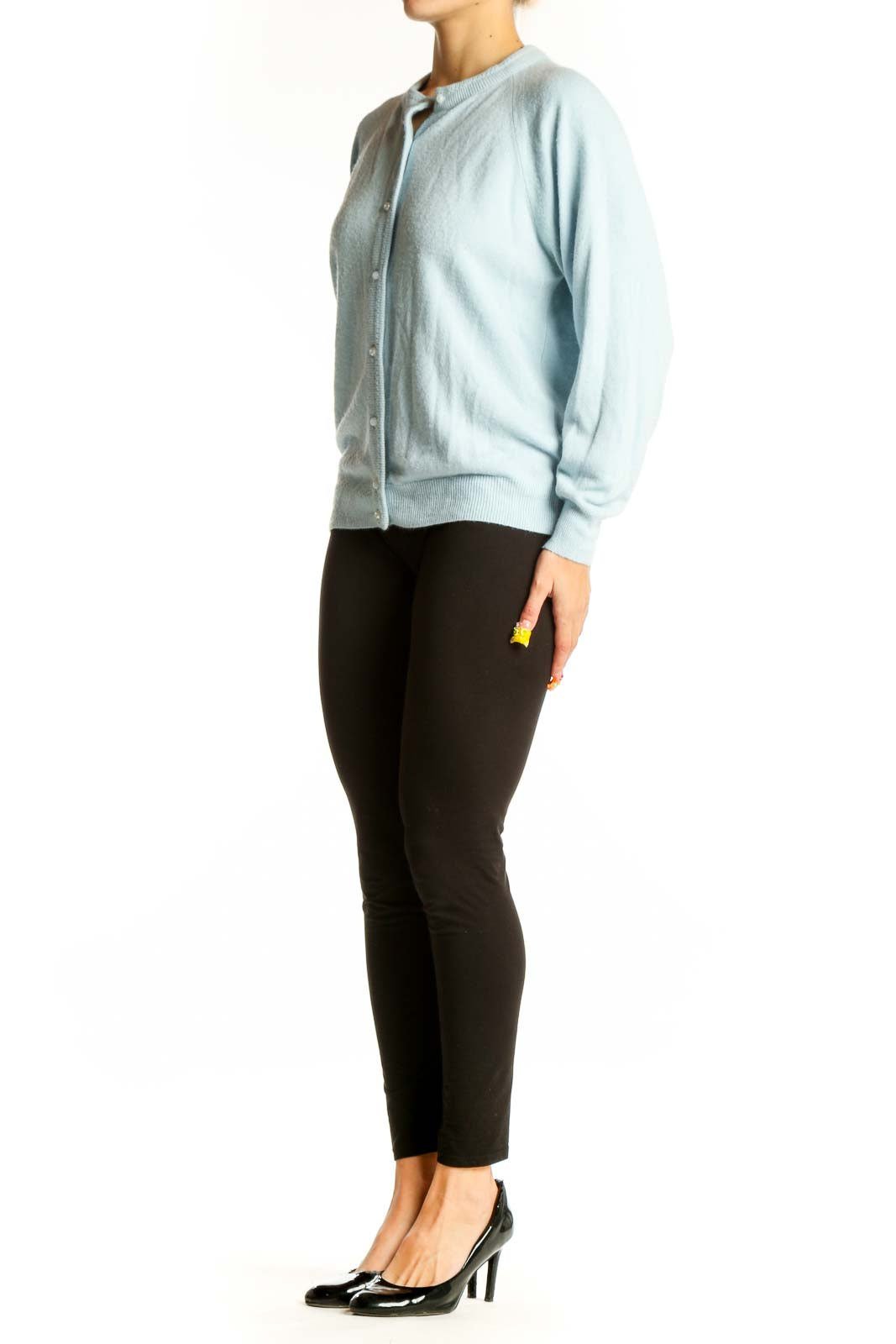 Front view of light blue acrylic button-up cardigan by Designers Originals