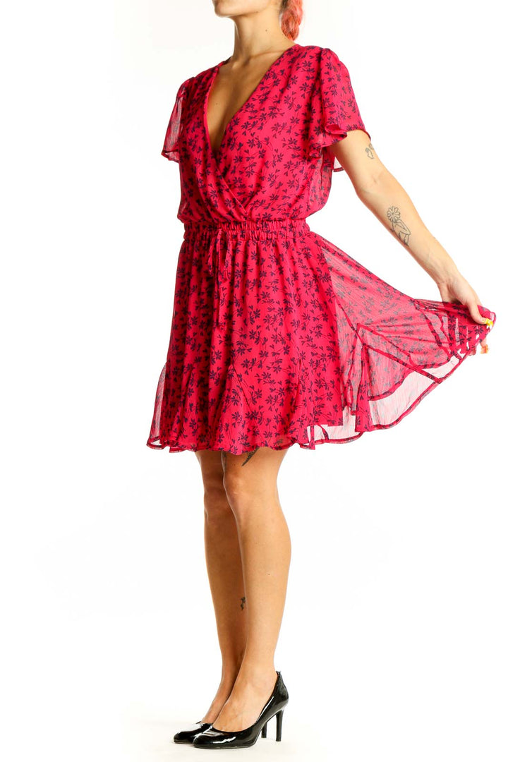 Front view of red floral wrap mini dress with v-neckline and short sleeves