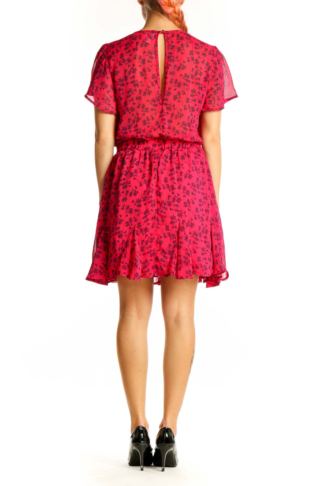 Side view of red floral wrap mini dress showing flared skirt and ruffle hem