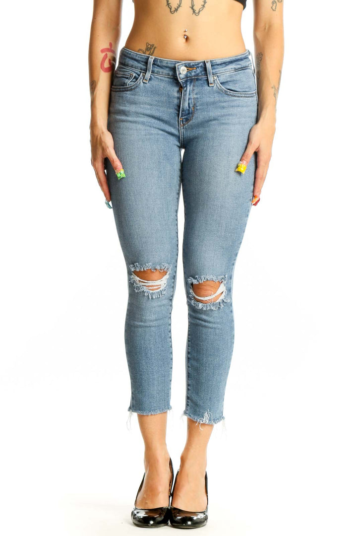 Front view of 711 Levis light blue distressed cropped skinny jeans