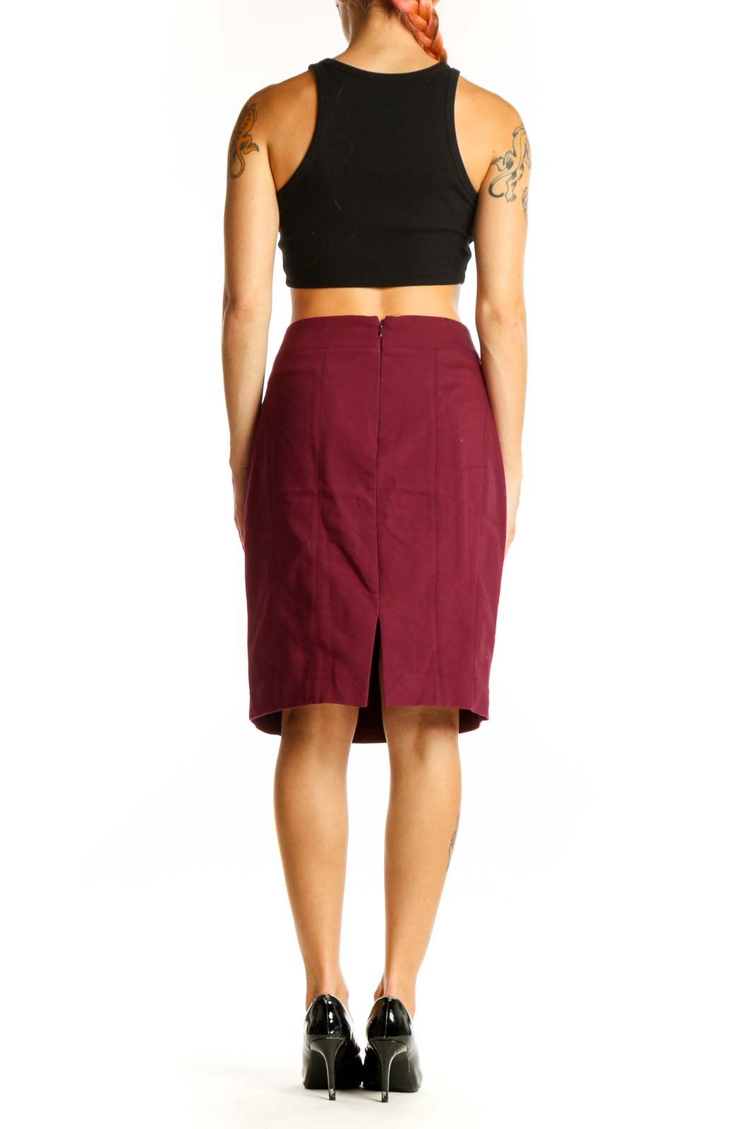 Side view of burgundy Express pencil skirt paired with black top