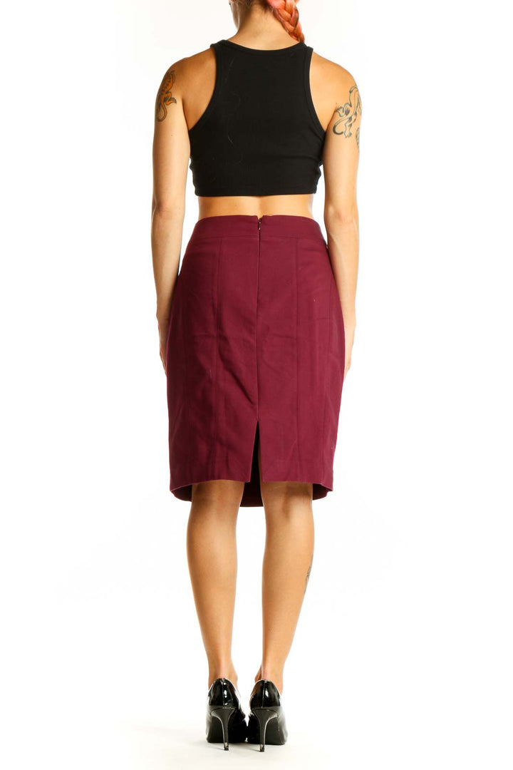Side view of burgundy Express pencil skirt paired with black top