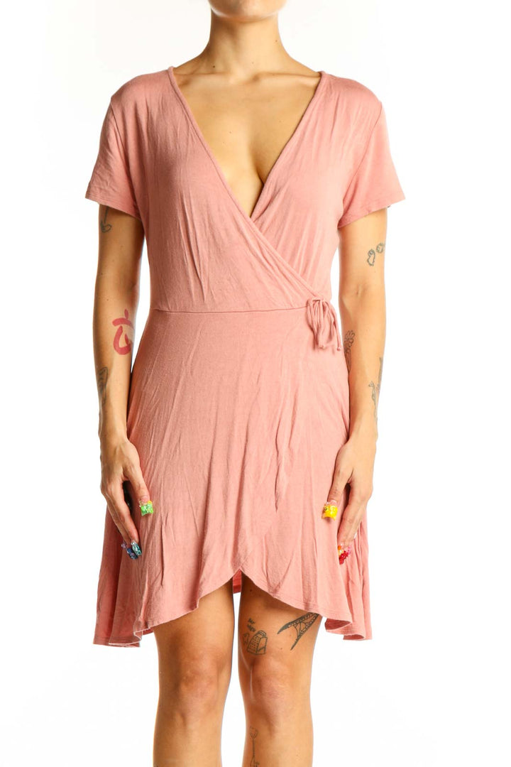 Front view of pink Rolla Coster wrap-style short sleeve top