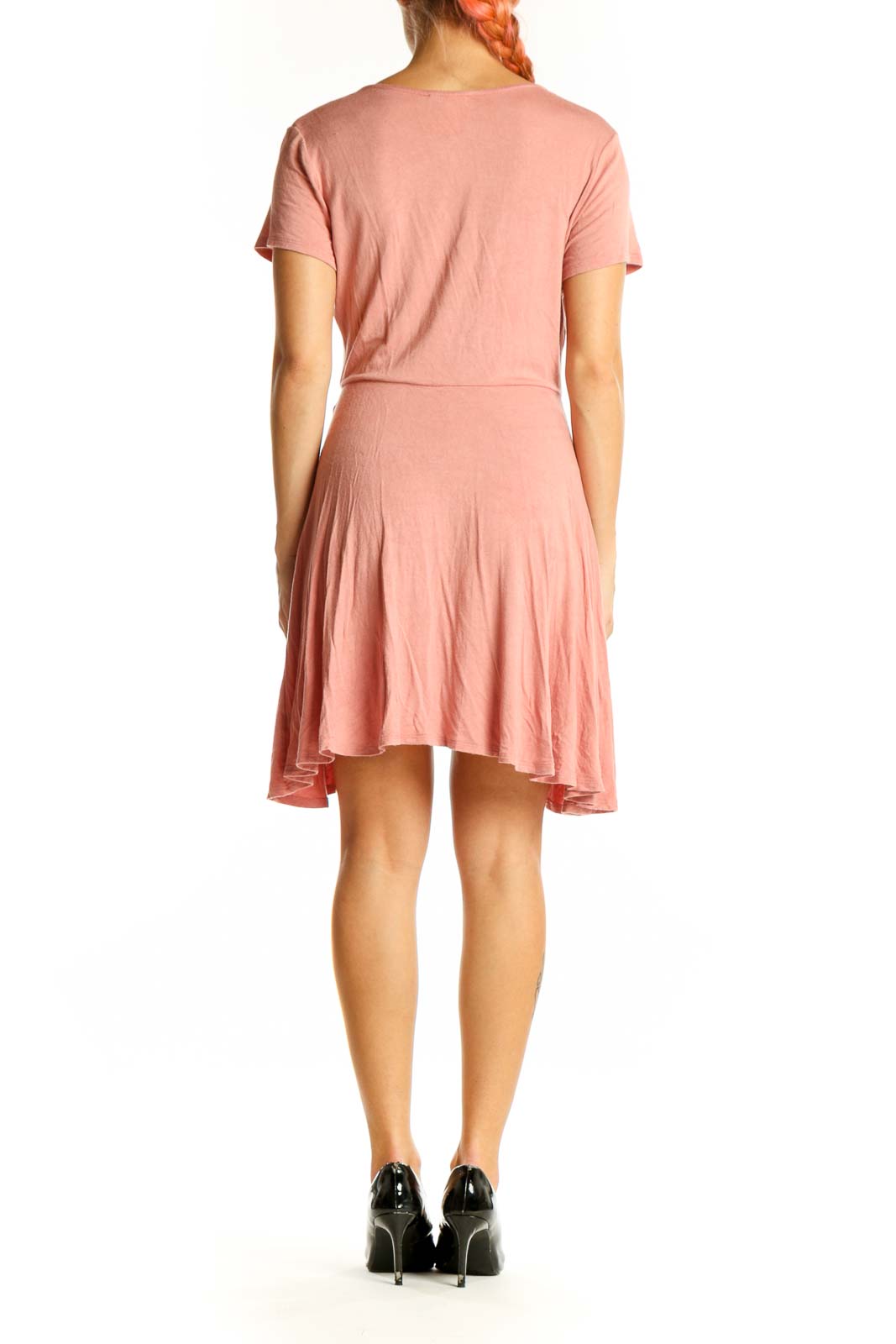 Side view of pink Rolla Coster wrap-style short sleeve top on model