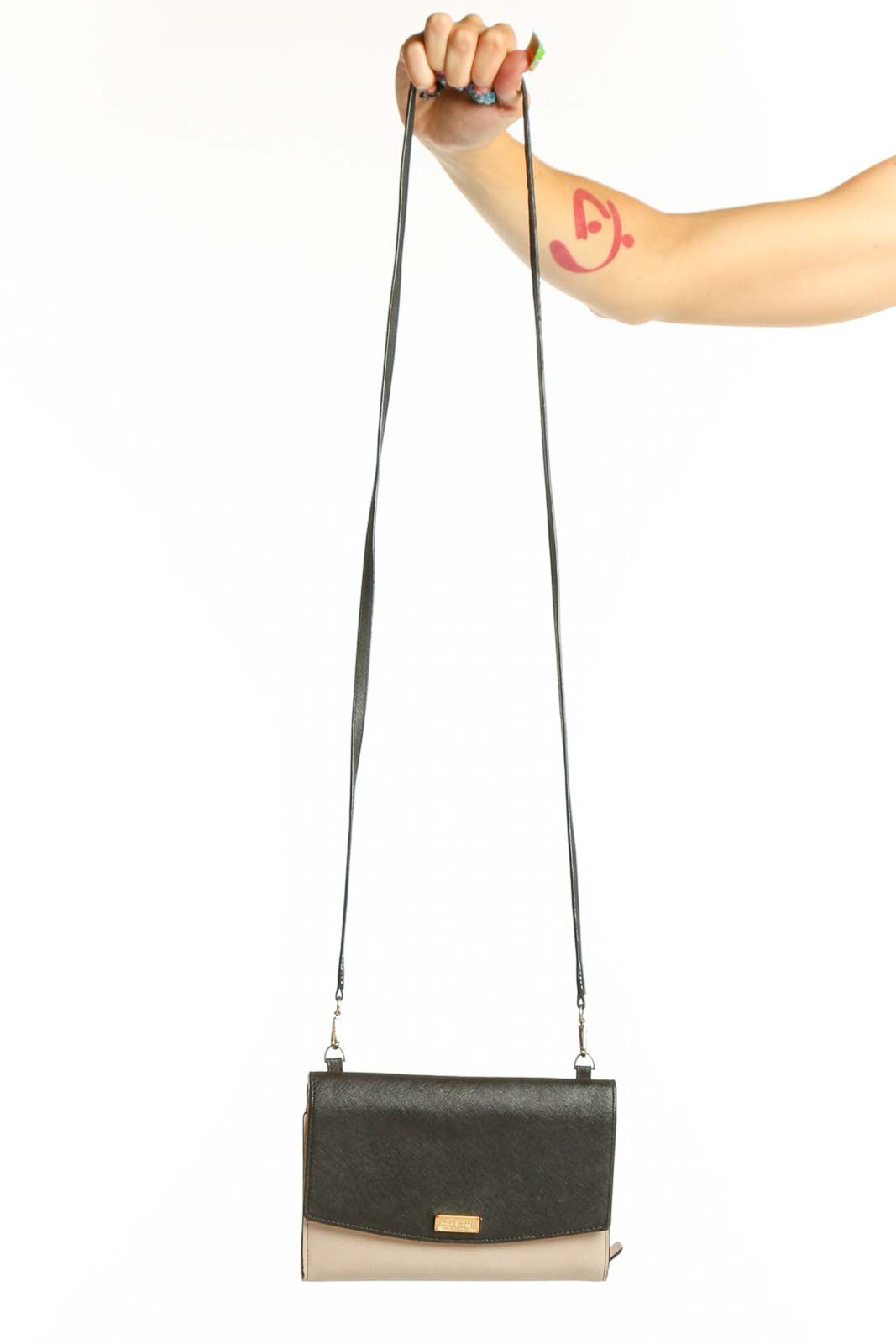 Front view of Kate Spade black and beige colorblock crossbody bag