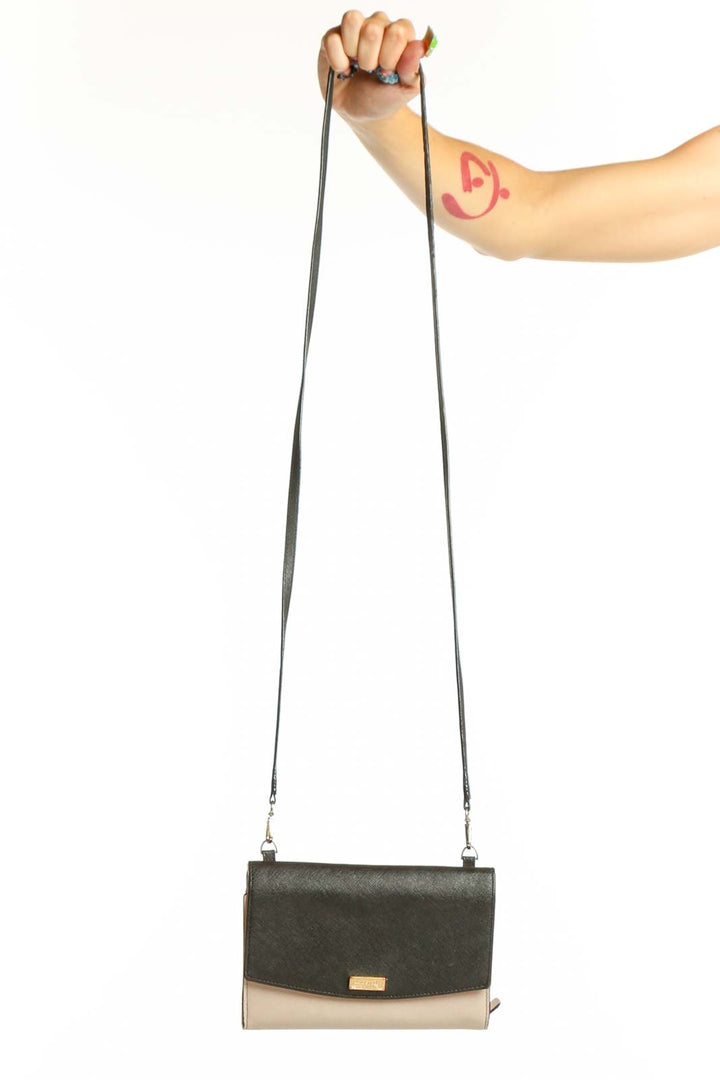 Front view of Kate Spade black and beige colorblock crossbody bag