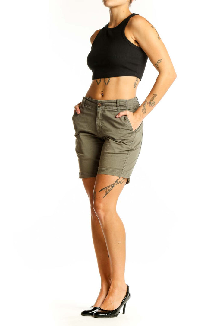 Front view of olive green Tentree 10 chino shorts on model