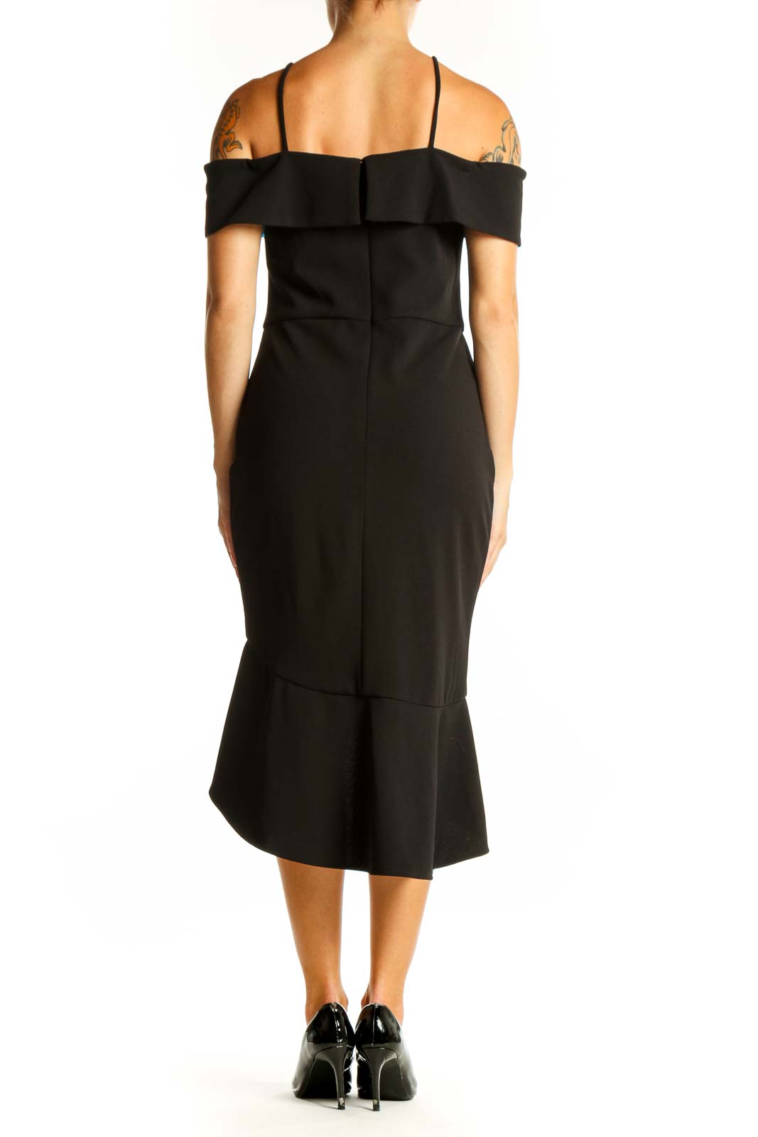 Side view of black off-shoulder ruffle cocktail dress by Bebe showing high-low hemline