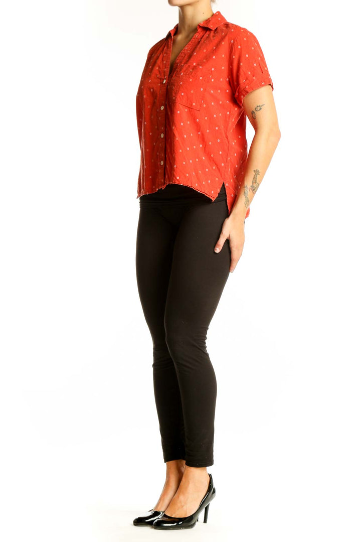 Front view of Madewell red polka dot short-sleeve button-up shirt