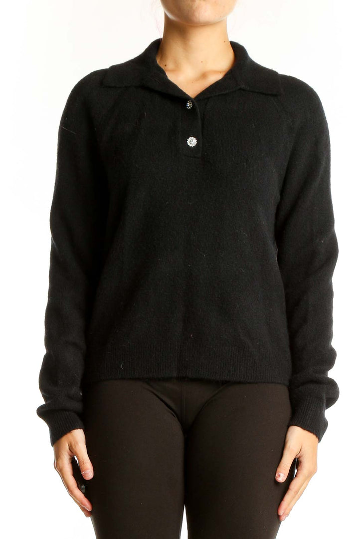 Front view of J.Crew black wool blend polo sweater on model