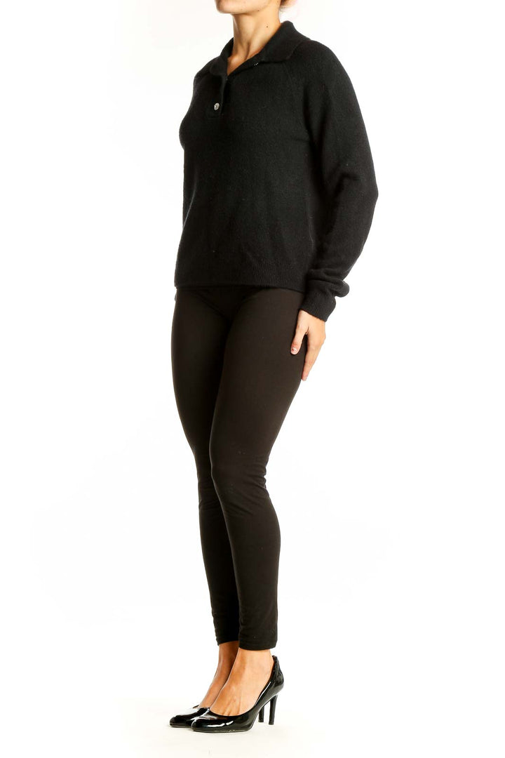 Front view of J.Crew black wool blend polo sweater on model