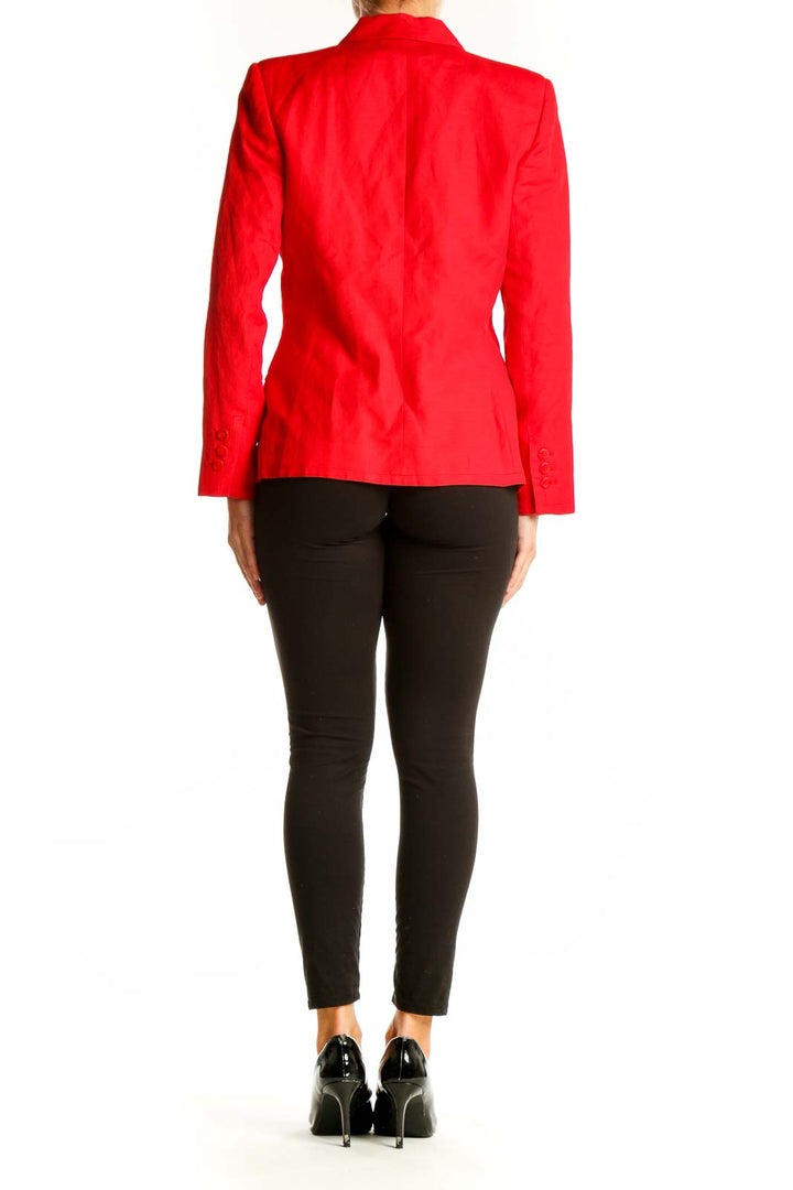 Side view of red Harve Bernard linen-blend blazer on model with black pants