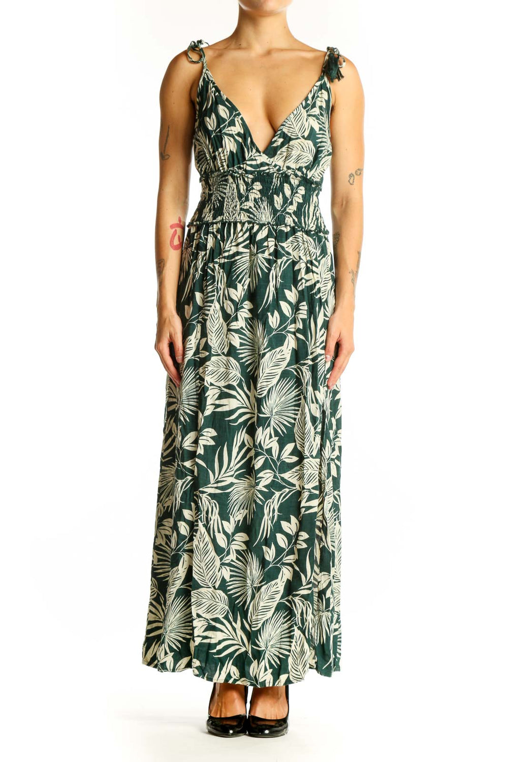 Front view of green tropical print maxi dress with V-neckline and tie straps