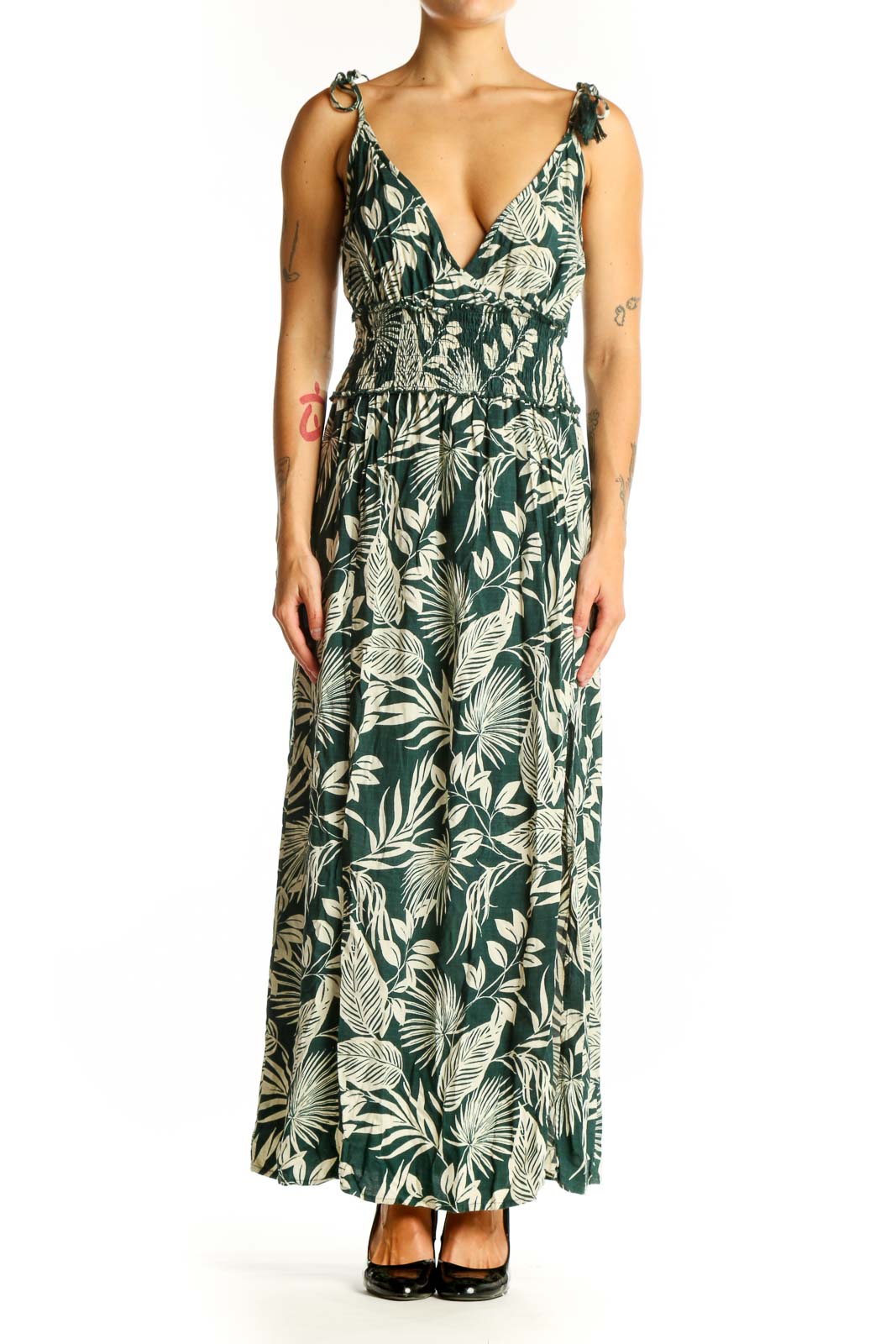 Front view of green tropical print maxi dress with V-neckline and tie straps