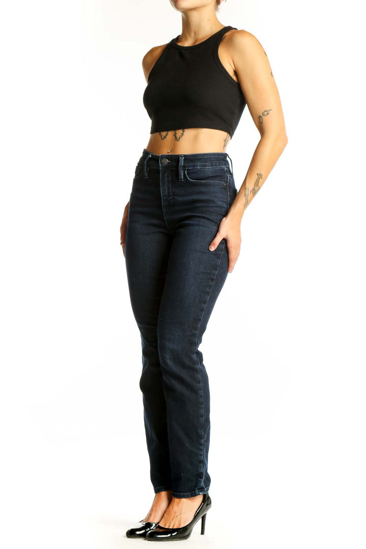 Front view of Athleta dark blue slim fit denim jeans on model