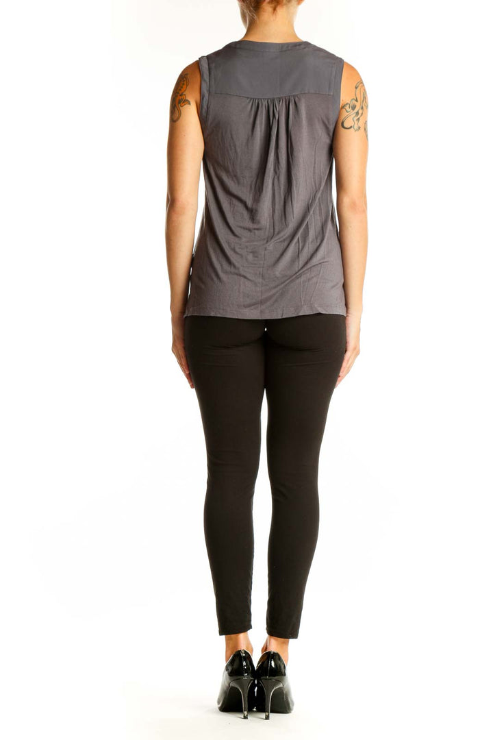 Side view of gray sleeveless top from Banana Republic on model