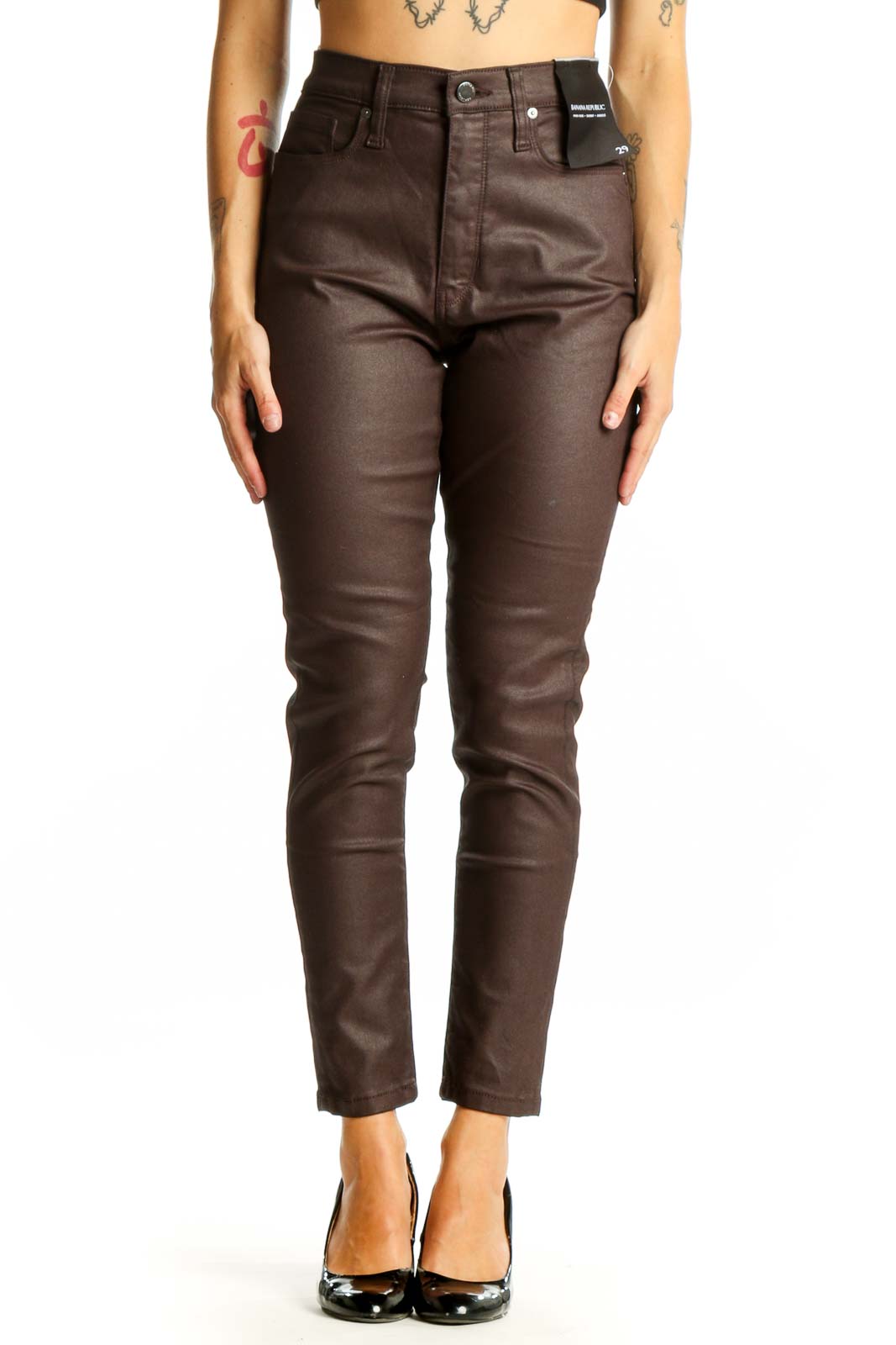 Front view of Banana Republic brown coated skinny jeans on model