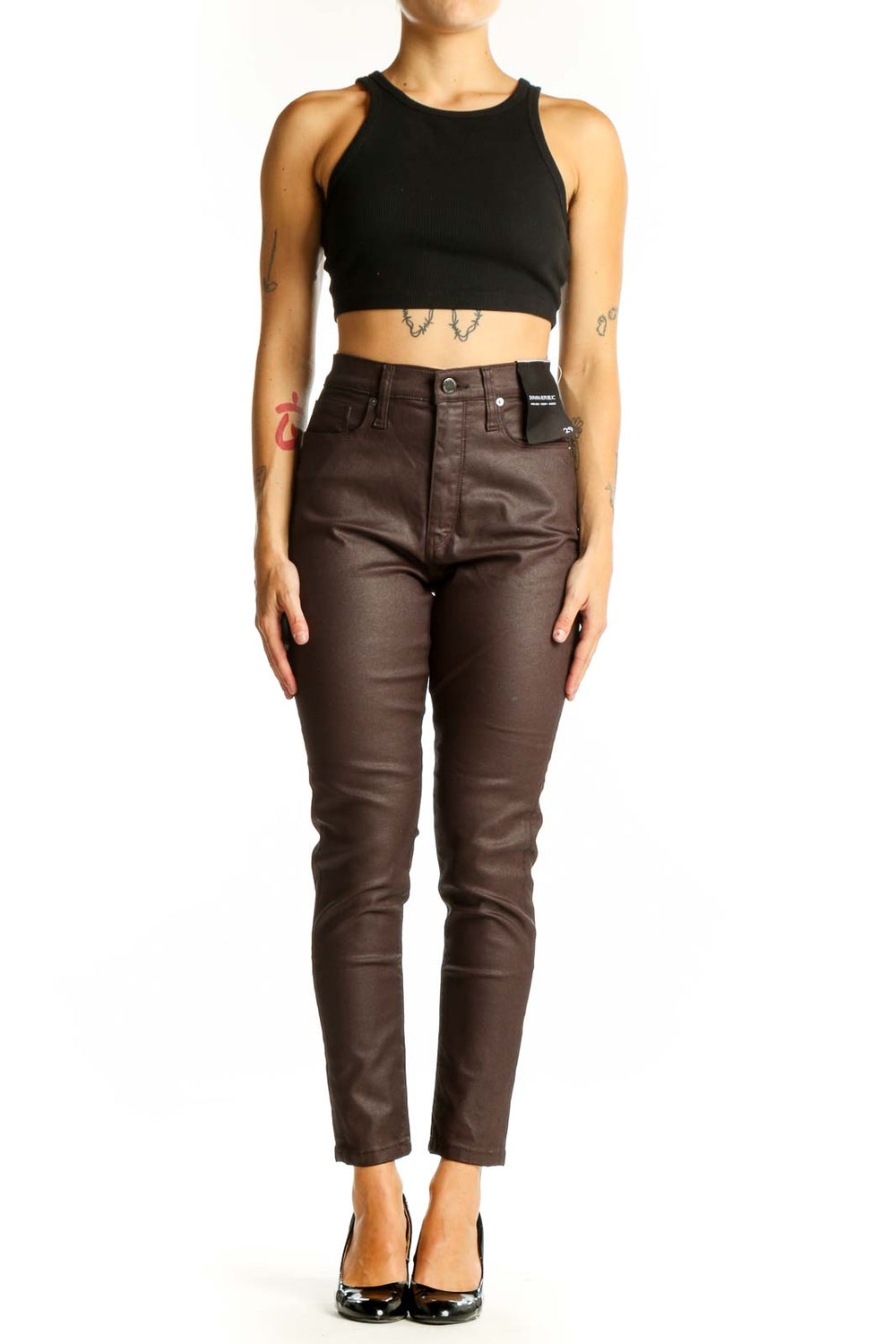 Front view of Banana Republic brown coated skinny jeans on model