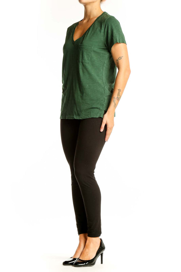 Front view of Madewell green V-neck cotton tee with chest pocket
