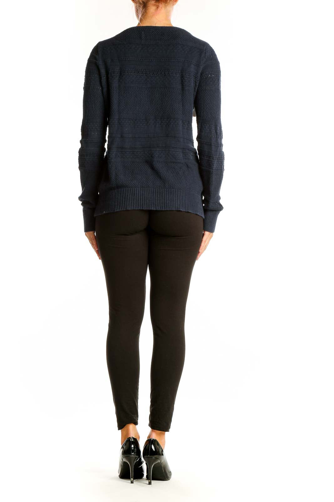 Side view of woman wearing LOFT navy textured cotton knit sweater with black pants