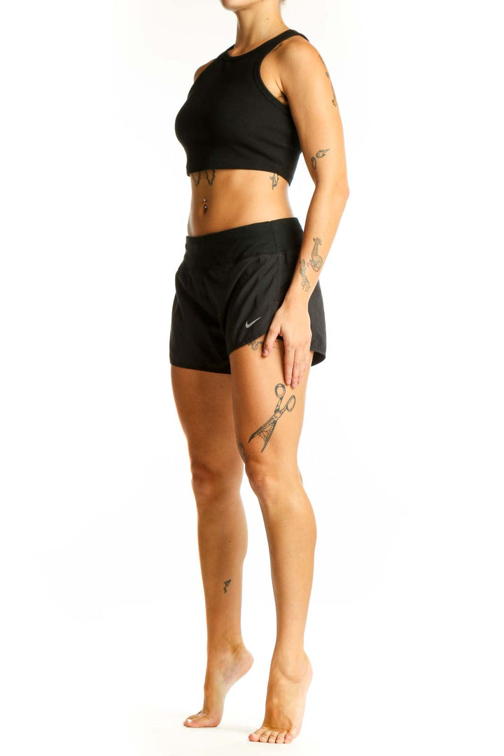 Front view of black Nike performance running shorts