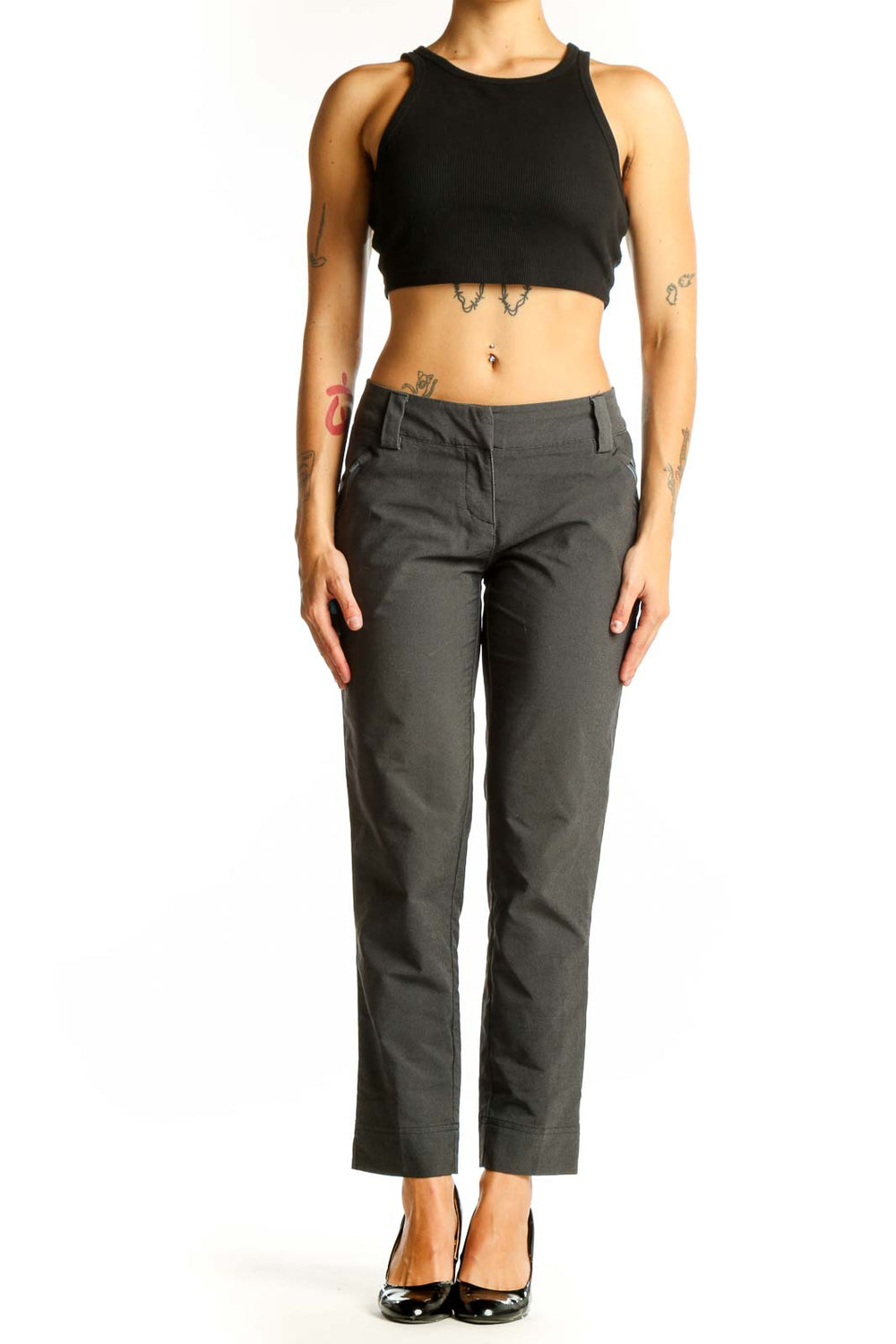 Front view of gray Adidas athletic pants on model