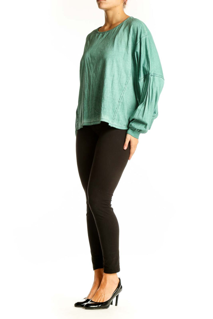 Front view of mint green oversized long sleeve top by Mustard Seed